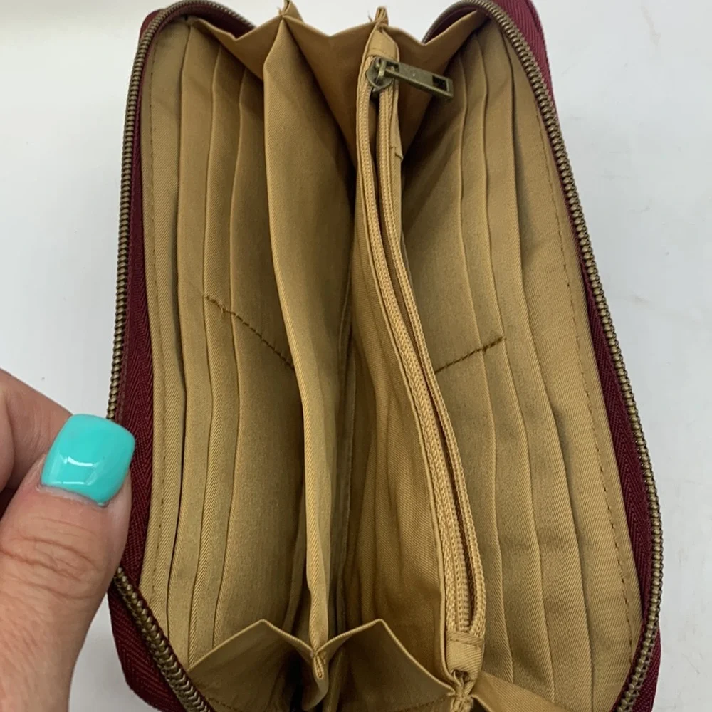 Red travelon standard size nylon wallet as is. SM3741